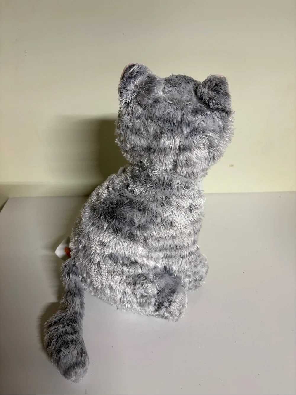 Melissa & Doug Greycie Tabby Cat, featuring soft grey and white patterned fur